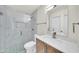 Modern bathroom with a glass-enclosed shower, marble tiling, a stylish vanity, and updated fixtures at 8146 N 17Th Dr, Phoenix, AZ 85021