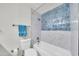Cozy bathroom features updated tiling in shower/bath combo and a large sink/vanity offering great functionality at 8146 N 17Th Dr, Phoenix, AZ 85021