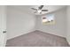 This carpeted bedroom is well-lit, has neutral walls, and includes a window view of the property outside at 8146 N 17Th Dr, Phoenix, AZ 85021