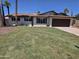 Attractive single-story home featuring a well-maintained lawn and a two-car garage at 8146 N 17Th Dr, Phoenix, AZ 85021