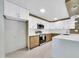 Well-lit, updated kitchen showcasing white cabinetry, stainless steel appliances, and an expansive central island at 8146 N 17Th Dr, Phoenix, AZ 85021