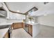 Open concept kitchen with granite countertops, stainless steel appliances, and sliding glass doors to the backyard at 8146 N 17Th Dr, Phoenix, AZ 85021