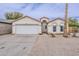 Charming single-story home with a two car garage and low maintenance desert landscaping in front yard at 8404 W Coronado Rd, Phoenix, AZ 85037