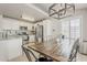 Kitchen and Dining Room combo with stainless appliances, modern cabinets, and a dining table at 8404 W Coronado Rd, Phoenix, AZ 85037