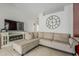 Comfortable living room with a cozy fireplace, tile flooring, and large sectional sofa at 8404 W Coronado Rd, Phoenix, AZ 85037