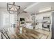 Bright living space featuring kitchen, dining and living room with neutral paint and tile floors at 8404 W Coronado Rd, Phoenix, AZ 85037