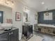 Bathroom with dual vessel sinks, granite counters, and tub with decorative tile surround at 8423 E Heatherbrae Dr, Scottsdale, AZ 85251