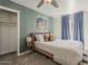 Comfortable bedroom with soft carpet, closet, and a modern ceiling fan at 8423 E Heatherbrae Dr, Scottsdale, AZ 85251