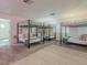 Spacious bunk room featuring four sets of bunk beds, soft carpeting, and neutral decor at 8423 E Heatherbrae Dr, Scottsdale, AZ 85251