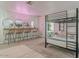 Spacious bedroom featuring bunk beds, a long vanity with four chairs, and stylish decor at 8423 E Heatherbrae Dr, Scottsdale, AZ 85251