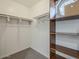 Walk-in closet with custom shelving and ample storage space for organized clothing and accessories at 8423 E Heatherbrae Dr, Scottsdale, AZ 85251