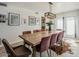 Well-lit dining room with a large table for eight and tasteful decor near the patio at 8423 E Heatherbrae Dr, Scottsdale, AZ 85251