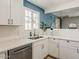 Bright and modern kitchen featuring white cabinets, stainless steel appliances, and subway tile backsplash at 8423 E Heatherbrae Dr, Scottsdale, AZ 85251