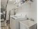 Well-equipped laundry room featuring modern appliances and ample storage space for convenience at 8423 E Heatherbrae Dr, Scottsdale, AZ 85251