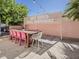 Inviting outdoor dining space with a trendy sign, perfect for gatherings and enjoying meals in the open air at 8423 E Heatherbrae Dr, Scottsdale, AZ 85251