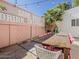 Charming outdoor dining area with a trendy sign, perfect for entertaining and enjoying meals outdoors at 8423 E Heatherbrae Dr, Scottsdale, AZ 85251
