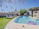 Beautiful pool area with lounge chairs and lush greenery, offering a relaxing outdoor retreat at 8423 E Heatherbrae Dr, Scottsdale, AZ 85251