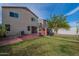 Spacious backyard featuring grassy area, concrete pavers, outdoor shed and a basketball hoop at 8905 W Jefferson St, Tolleson, AZ 85353