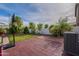 Backyard featuring grassy area, concrete pavers, and a basketball hoop at 8905 W Jefferson St, Tolleson, AZ 85353