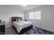 Clean bedroom with a bed, natural light, and carpet flooring at 8905 W Jefferson St, Tolleson, AZ 85353