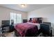 Well-lit bedroom featuring neutral colors, a large window, and a comfortable bed at 8905 W Jefferson St, Tolleson, AZ 85353