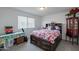 Comfortable bedroom with a bed, natural light, and a floral bedspread at 8905 W Jefferson St, Tolleson, AZ 85353