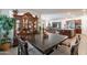Bright dining room boasts an open layout, a dark wood table, and an elegant hutch at 8905 W Jefferson St, Tolleson, AZ 85353
