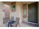 Inviting covered front porch with seating area, perfect for relaxing and enjoying the outdoors at 8905 W Jefferson St, Tolleson, AZ 85353