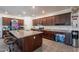 Spacious kitchen with granite countertops, stainless steel appliances, and a large island with bar seating at 8905 W Jefferson St, Tolleson, AZ 85353