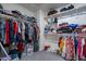 Organized walk-in closet with ample shelving and hanging space for clothes and accessories at 8905 W Jefferson St, Tolleson, AZ 85353