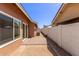 View of backyard featuring block wall fencing and hardscaped patio area at 915 E Annette Dr, Phoenix, AZ 85022