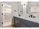 Renovated bathroom featuring dual sinks, quartz countertops, and sleek fixtures at 915 E Annette Dr, Phoenix, AZ 85022