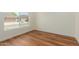 Bright bedroom with laminate floors and large window with view of neighborhood at 915 E Annette Dr, Phoenix, AZ 85022