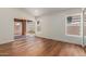 Bright bedroom with vaulted ceilings, wood floors, and sliding glass doors to the backyard at 915 E Annette Dr, Phoenix, AZ 85022