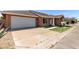 A wide driveway and attached two-car garage provide ample parking at this lovely home at 915 E Annette Dr, Phoenix, AZ 85022