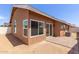 Rear exterior of home with view of the covered patio and stucco wall at 915 E Annette Dr, Phoenix, AZ 85022