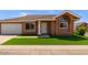 Charming single-story home featuring a manicured lawn and attached two-car garage at 915 E Annette Dr, Phoenix, AZ 85022
