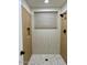 This tiled shower features a rainfall shower head and mosaic flooring at 915 E Annette Dr, Phoenix, AZ 85022