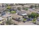 Aerial view of a residential neighborhood showcasing well-maintained homes, with many featuring private pools at 12046 W Flores Dr, El Mirage, AZ 85335