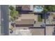Aerial view showcasing a backyard with artificial turf, gravel, a pool and a gazebo at 12046 W Flores Dr, El Mirage, AZ 85335
