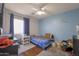 Comfortable bedroom featuring carpeted floors, natural light, and ample space at 12046 W Flores Dr, El Mirage, AZ 85335