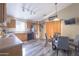 Bright and airy kitchen with a modern black appliance package, and dining area at 12046 W Flores Dr, El Mirage, AZ 85335