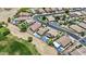 Aerial view of a community with multiple pools and manicured lawns at 12214 W Madison St, Avondale, AZ 85323