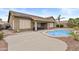 Backyard featuring a pool and a covered patio, ideal for outdoor relaxation and entertaining at 12214 W Madison St, Avondale, AZ 85323