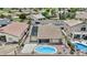 Aerial view of a fenced backyard with a beautiful pool and an outdoor seating area at 12214 W Madison St, Avondale, AZ 85323