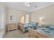 Cozy bedroom with two twin beds, natural light, and neutral color palette at 12214 W Madison St, Avondale, AZ 85323