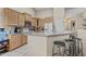 Well-equipped kitchen featuring a breakfast bar, modern appliances, and plenty of storage at 12214 W Madison St, Avondale, AZ 85323