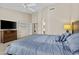 Comfortable main bedroom boasts natural light, modern furniture, and relaxing ambience at 12214 W Madison St, Avondale, AZ 85323