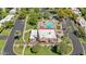 Aerial view of community, pool, tennis courts, and surrounding landscaping at 131 N Higley Rd # 117, Mesa, AZ 85205