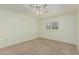 Cozy bedroom with neutral walls and flooring, and natural light from window at 131 N Higley Rd # 117, Mesa, AZ 85205